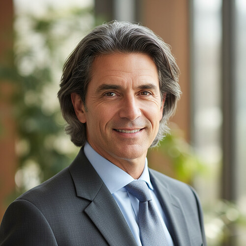 Confident mature man with a full, natural head of hair.