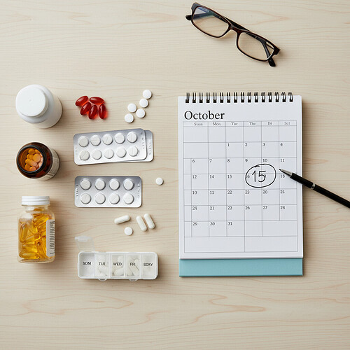 Medications and supplements laid out for pre-hair transplant review